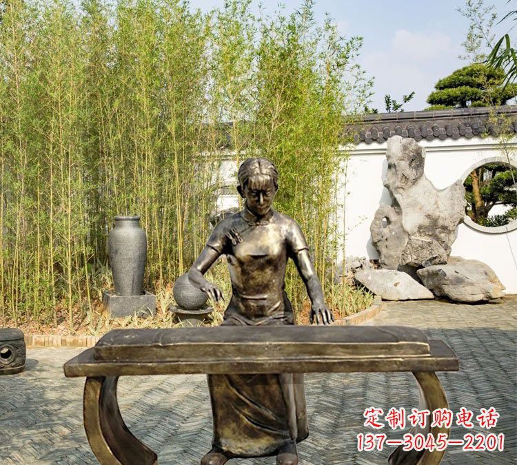益阳铜雕弹古筝人物